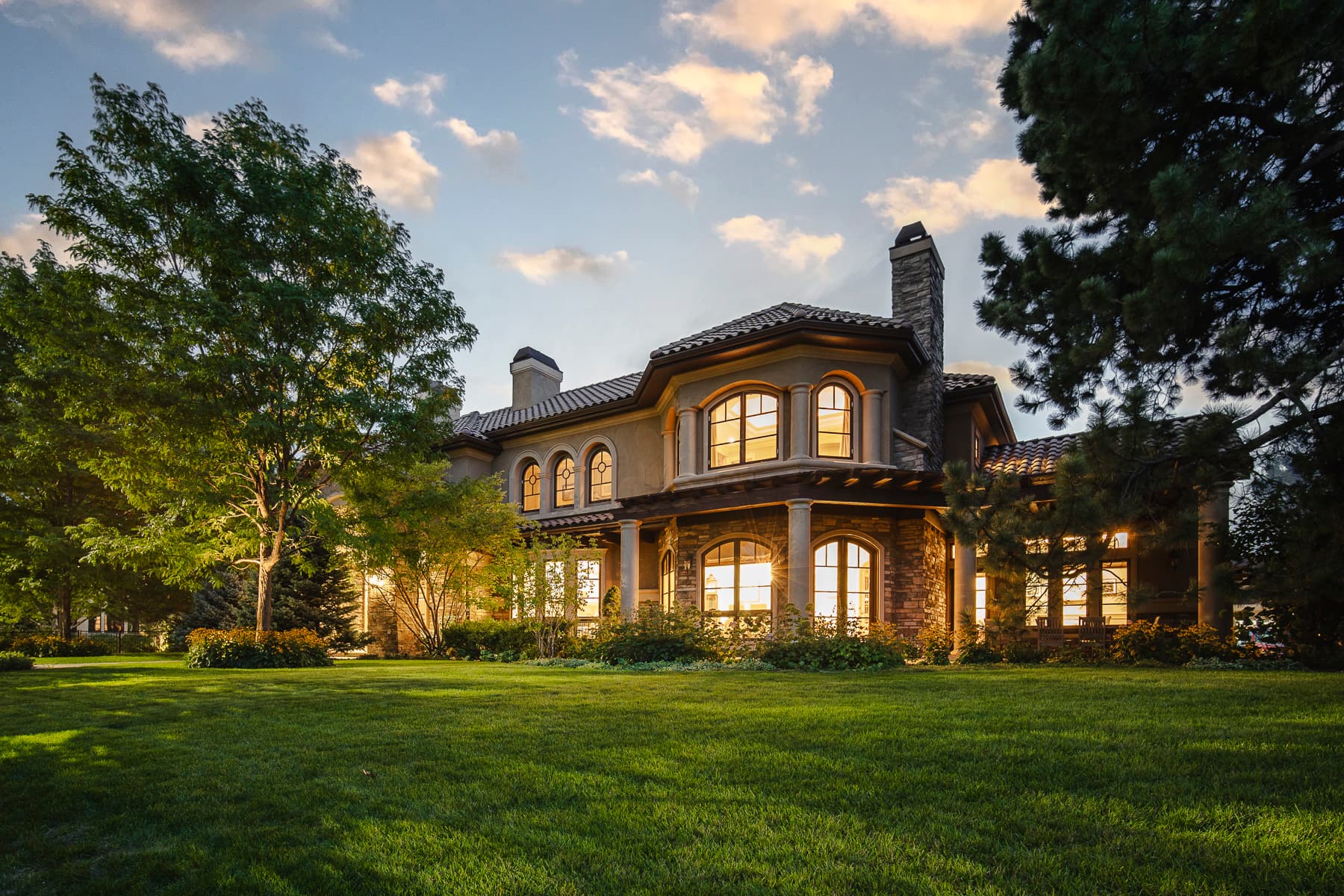 a photo of a mansion taken in the evening